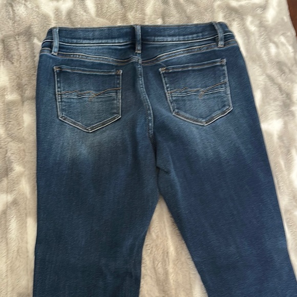 New York & Company Blue Skinny Jeans with Faded Distressing - Picture 3 of 5